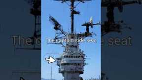 Where is the captain's cabin, chair, and seat located on an aircraft Carrier?